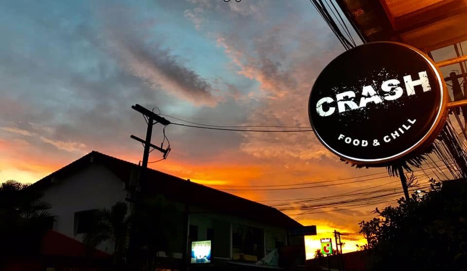 The round Crash sign against a Kamala sunset